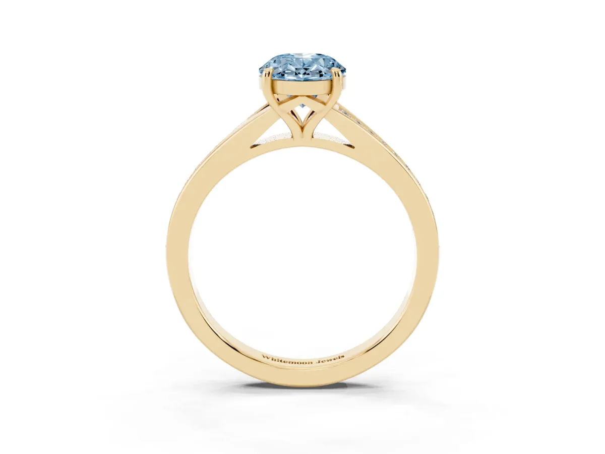 Fancy Blue Oval Cut Diamond Solitaire Ring with Pavé Band and Prong Setting Yellow gold