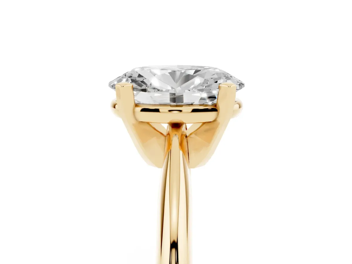 Oval Cut Cut Solitaire Ring with Four-Prong Setting on a Classic Band Yellow gold