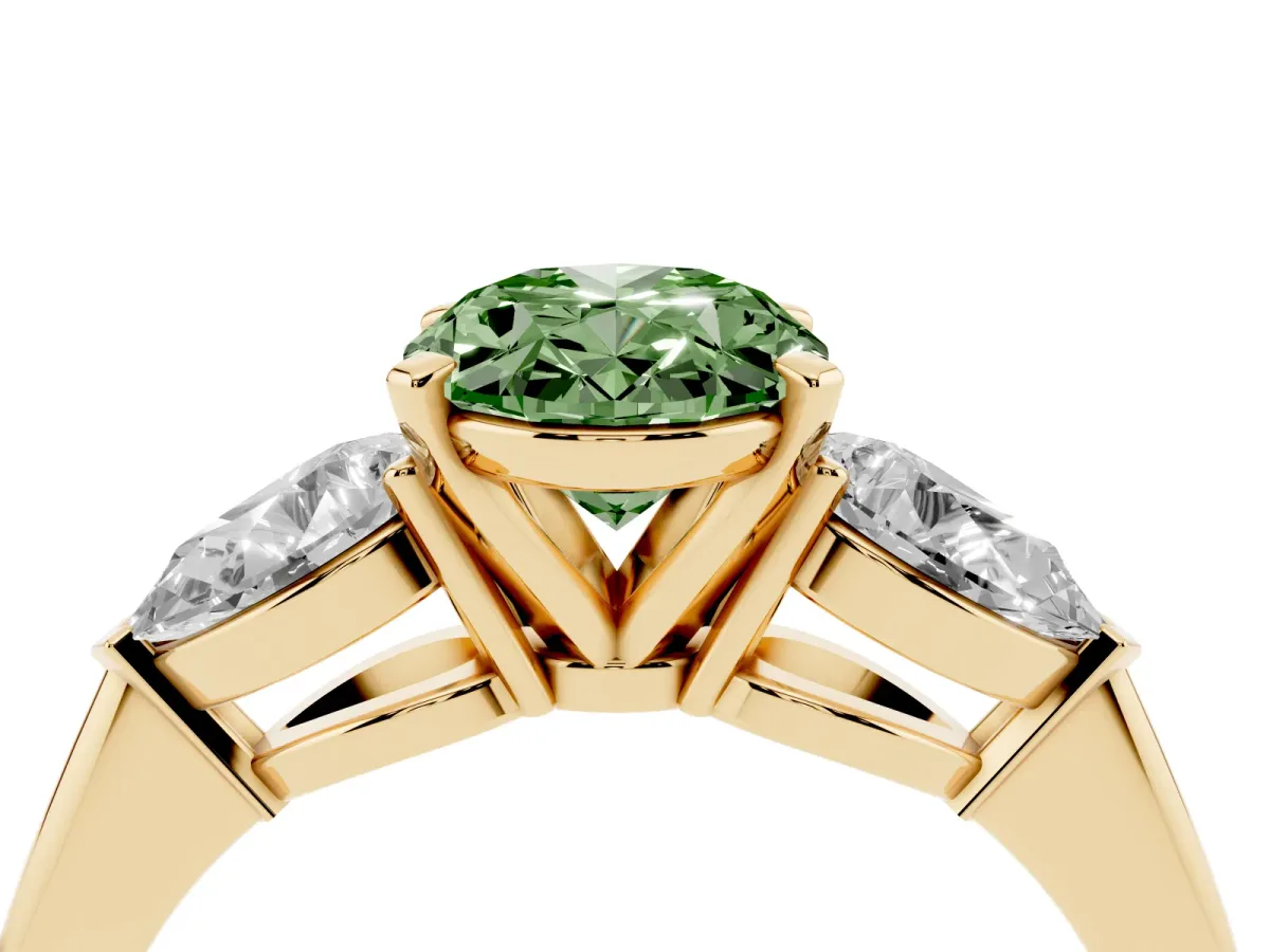 Fancy Green Three-Stone Oval Cut Diamond Ring with Pear Side Stones and Four-Prong Setting Yellow gold