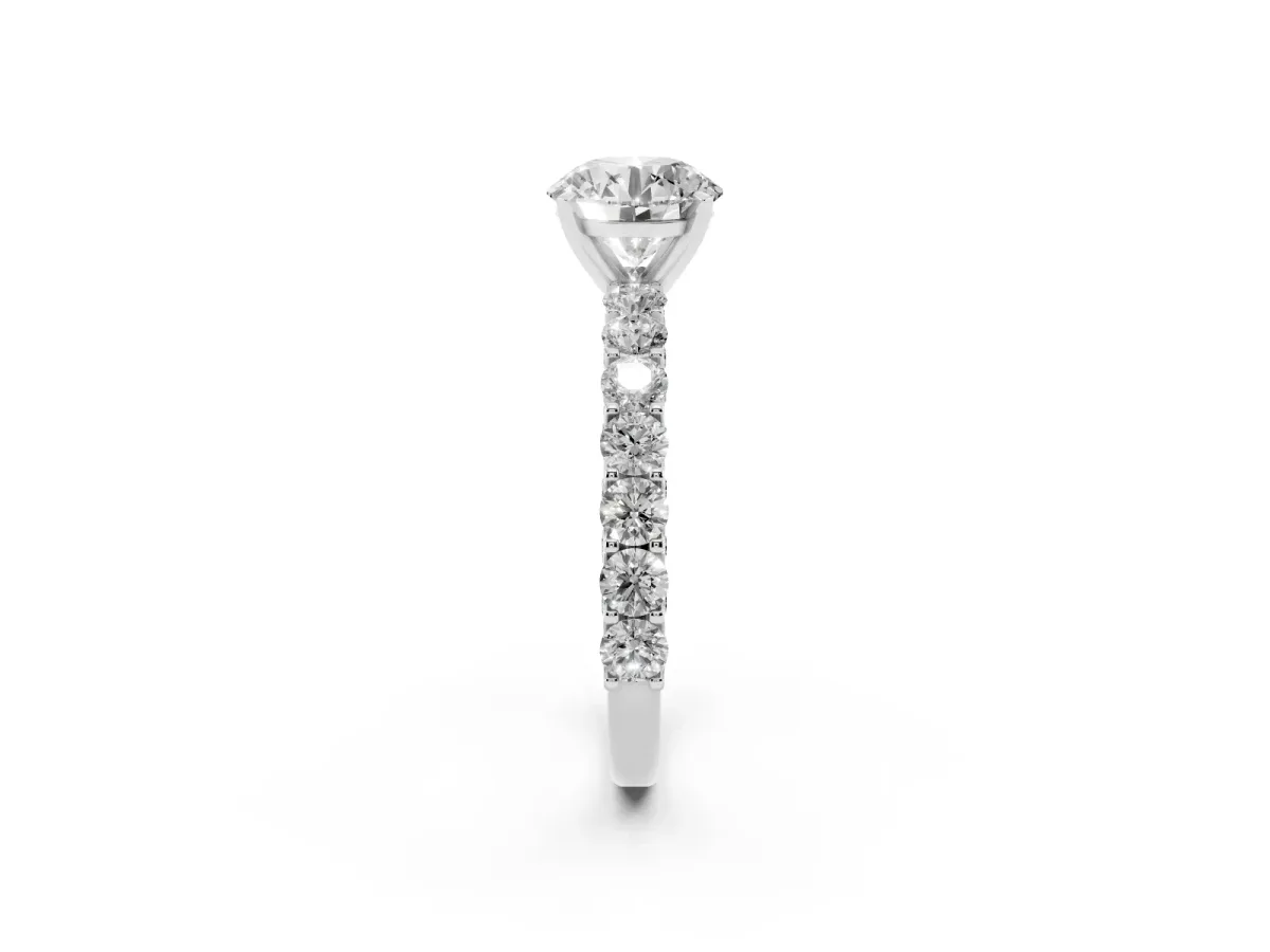 Round Cut Diamond Solitaire Ring with Shared Prong Pavé Band and Four-Prong Setting Silver