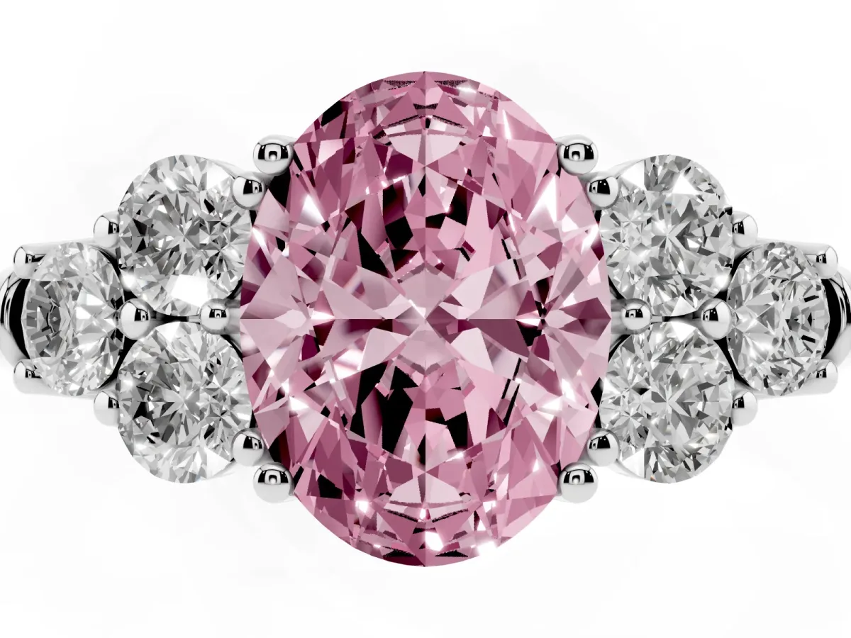 Fancy Pink Oval Cut Cut Diamond Cluster Ring with Round Accent Stones and Prong Setting on a Classic Band Platinum