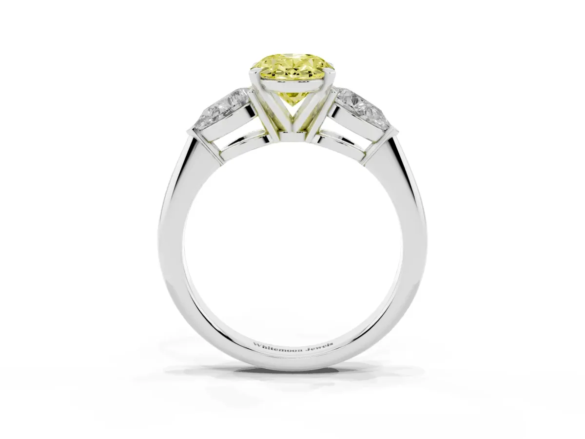 Fancy Yellow Three-Stone Oval Cut Diamond Ring with Pear Side Stones and Four-Prong Setting Platinum