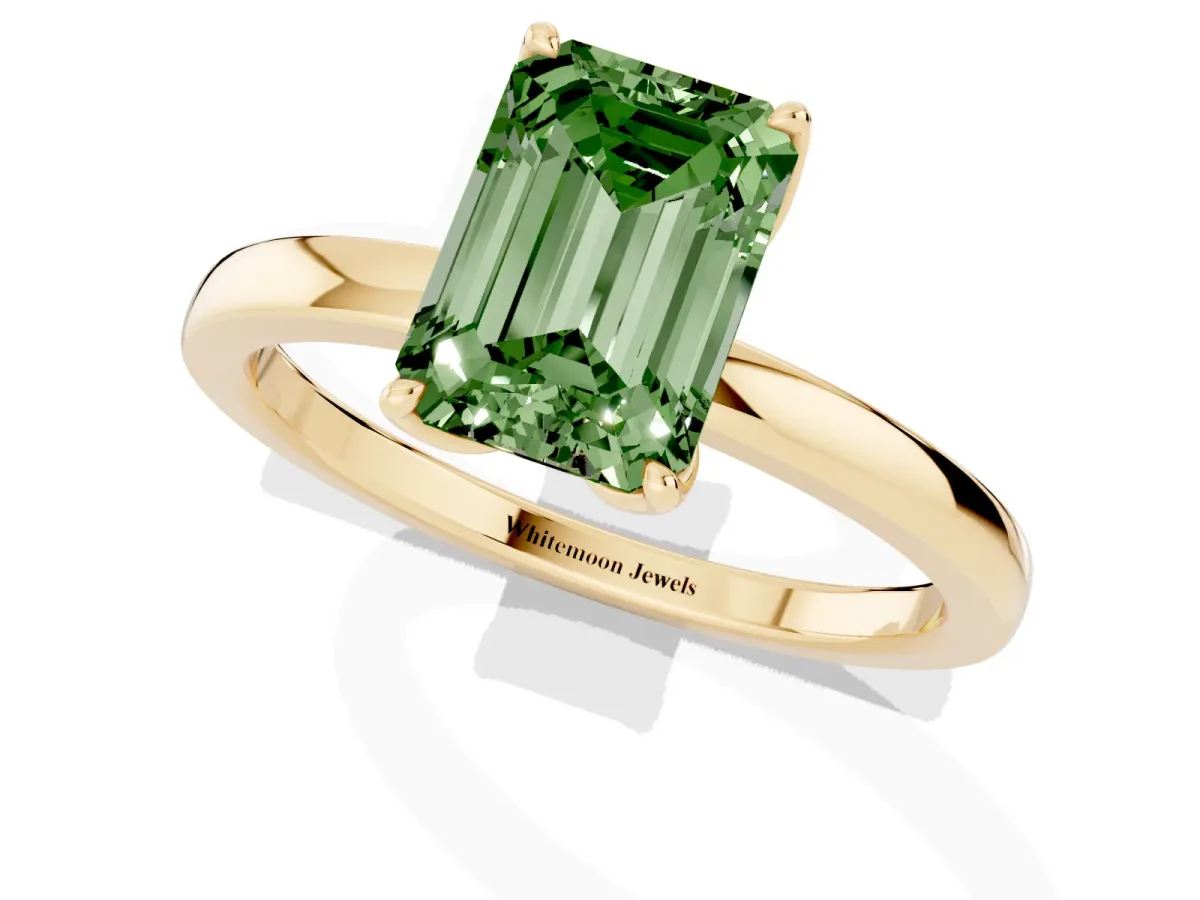 Fancy Green Emerald Cut Diamond Solitaire Ring with Thin Band and Prong Setting Yellow gold