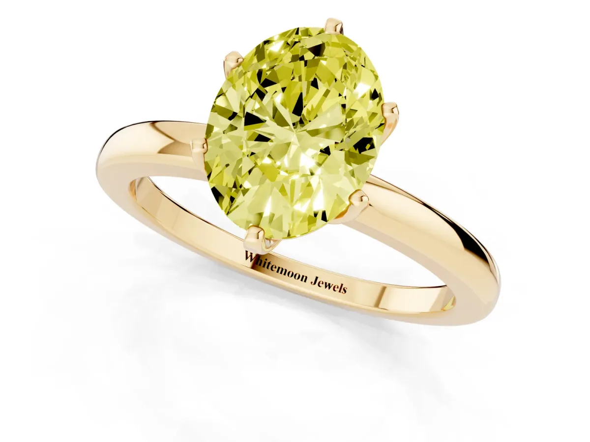 Fancy Yellow Oval Cut Solitaire Diamond Ring with Six-Prong Setting on a Classic Band Yellow gold