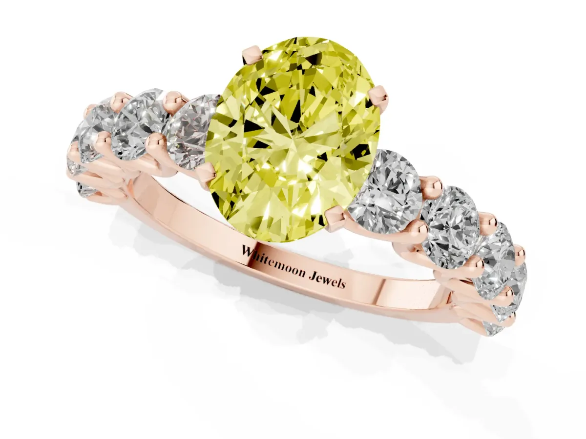 Fancy Yellow Oval Cut Diamond Prong Setting with Side Stones on a Pave Band Rose gold