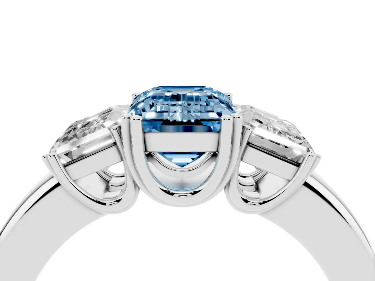 Fancy Blue Three-Stone Emerald Cut Cut Diamond Ring with Channel Set Band and Four-Prong Setting Silver