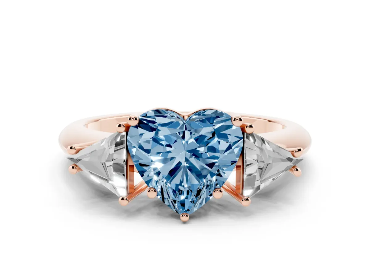 Fancy Blue Three-Stone Heart Cut Diamond Engagement Ring with Trillion Side Stones and Prong Setting Rose gold