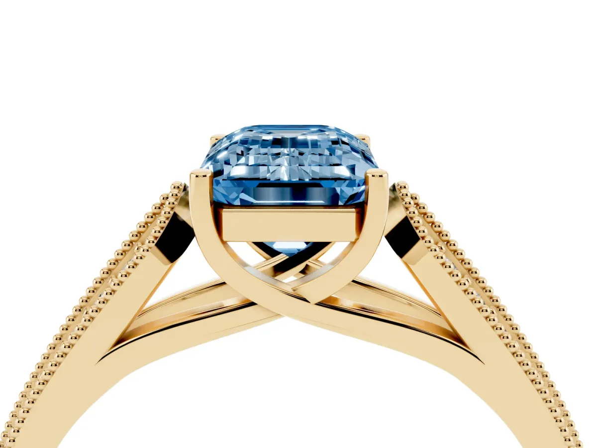Fancy Blue Emerald Cut Cut Pave Split Shank Engagement Ring with Four-Prong Setting Yellow gold