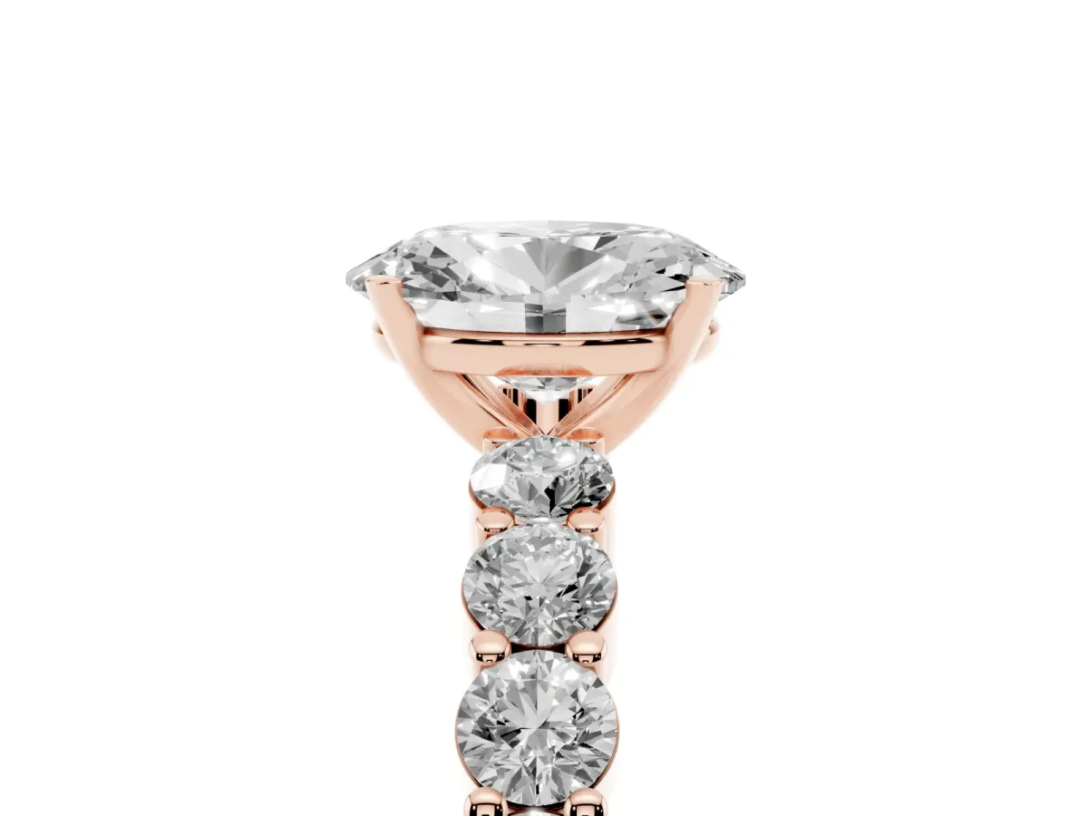 Oval Cut Diamond Solitaire Ring with Shared Prong Round Side Stones Rose gold