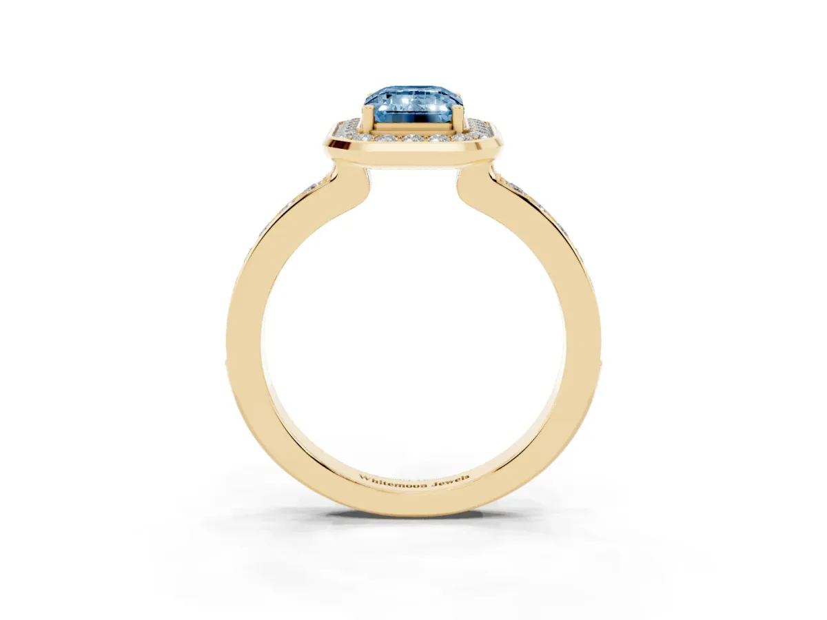 Fancy Blue Emerald Cut Diamond Halo Ring with Bezel Frame and Pavé Band Yellow gold