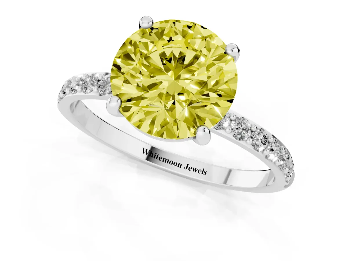 Fancy Yellow Round Cut Diamond Solitaire Ring with Round Pavé Band and Prong Setting Silver
