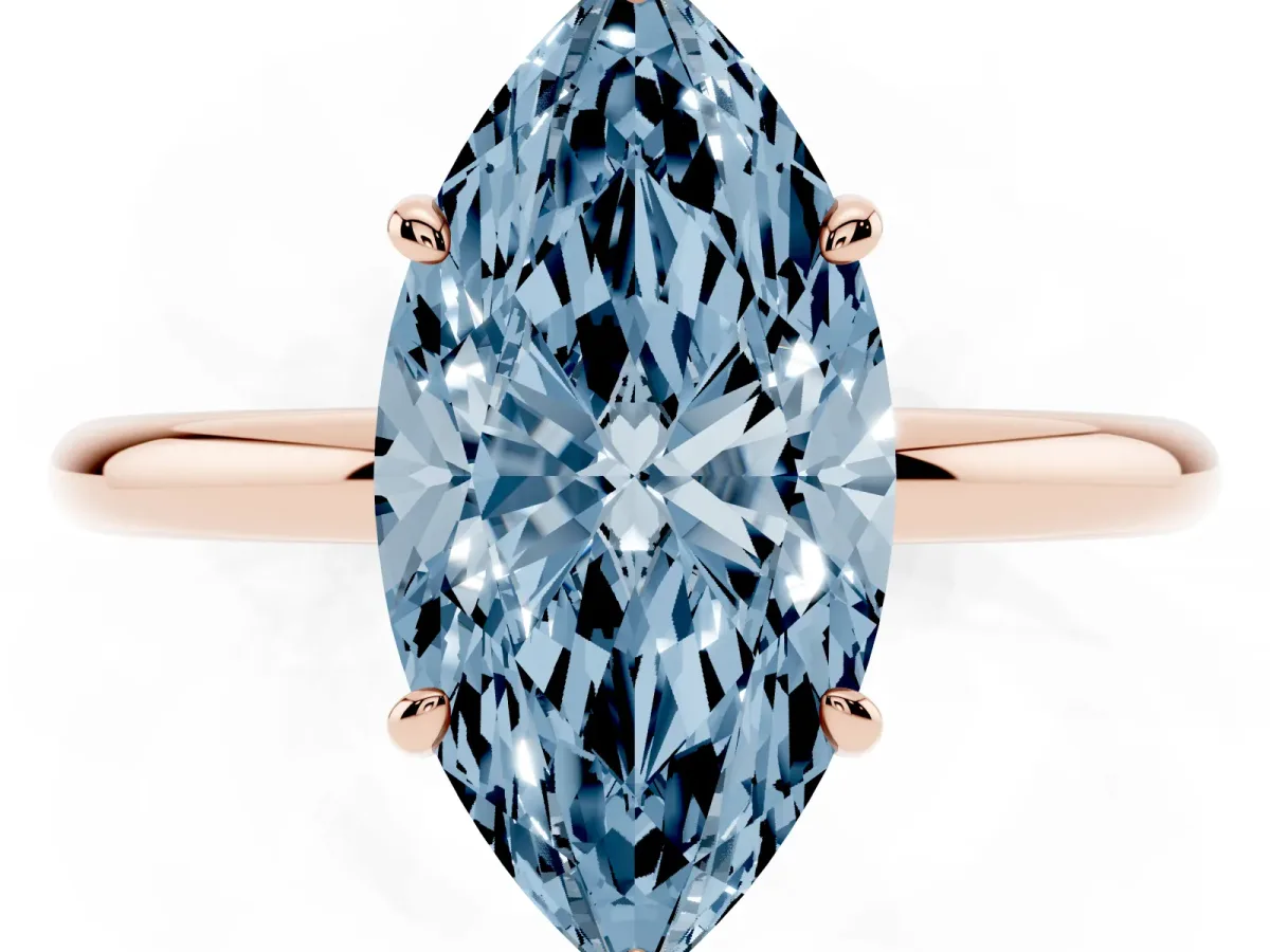Fancy Blue Oval Cut Solitaire Diamond Ring with Four-Prong Setting on a Plain Band Rose gold
