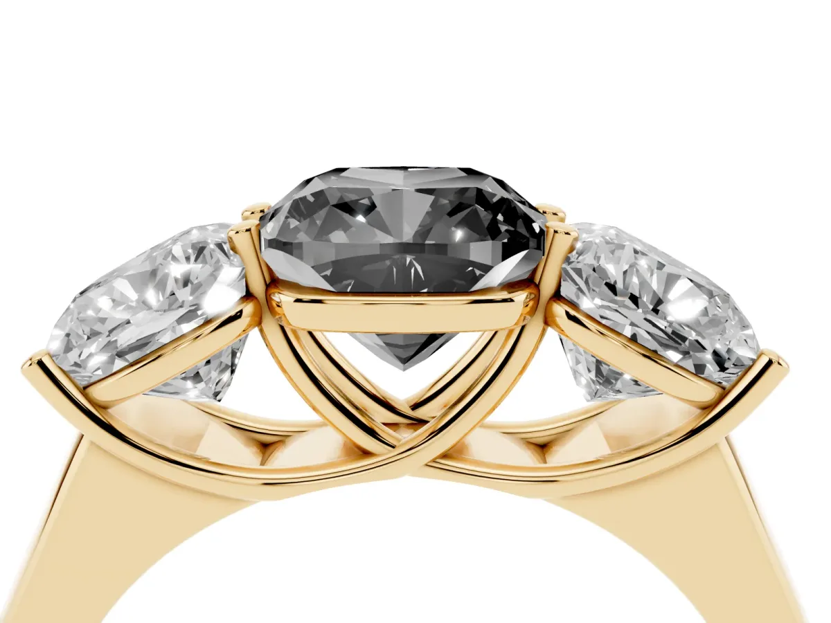 Fancy Black Cushion Cut Three-Stone Diamond Ring with Prong Setting on a Classic Band Yellow gold