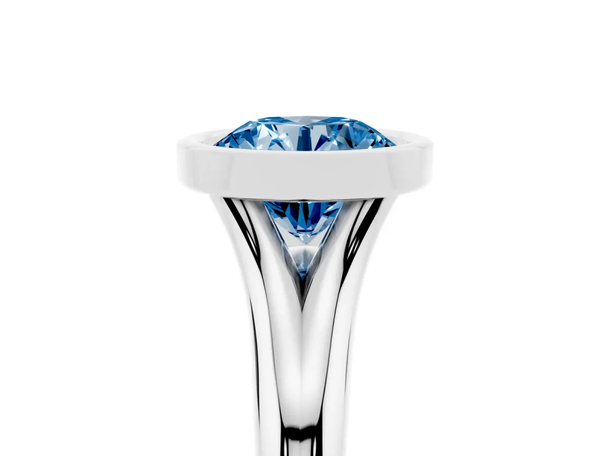 Fancy Blue Bezel Set Round Cut Solitaire Diamond Ring with Smooth Band Silver