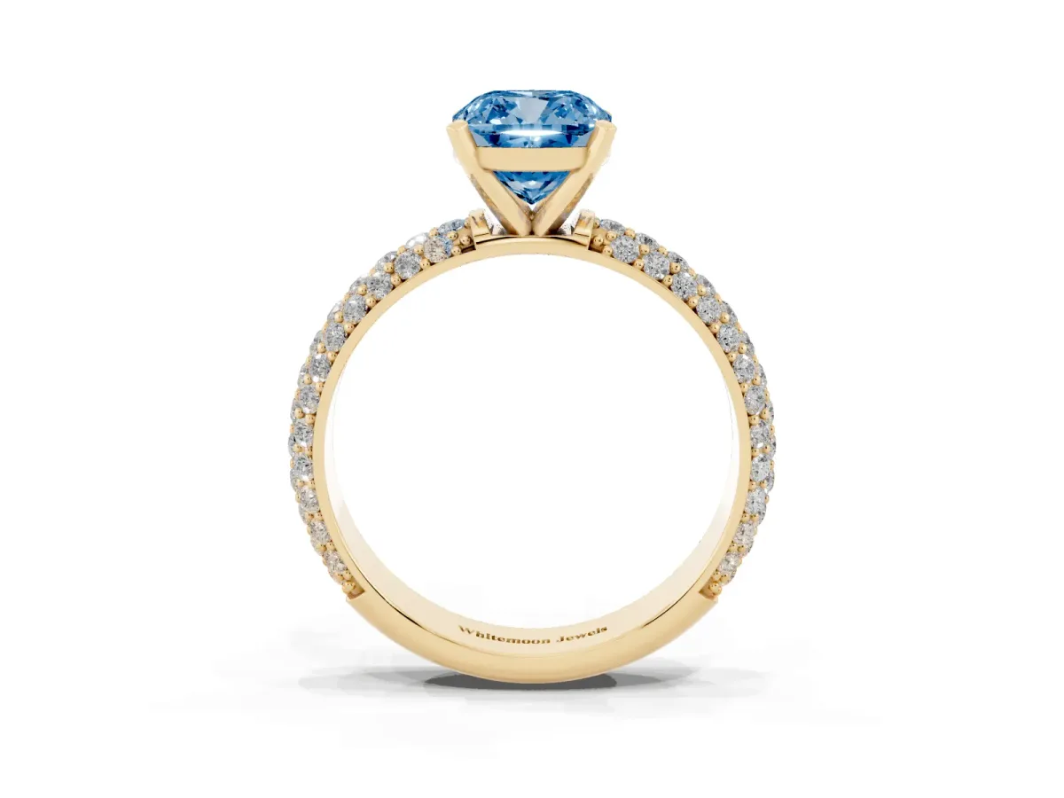 Fancy Blue Cushion Cut Diamond Solitaire Ring with Prong Setting and Pavé Band Yellow gold