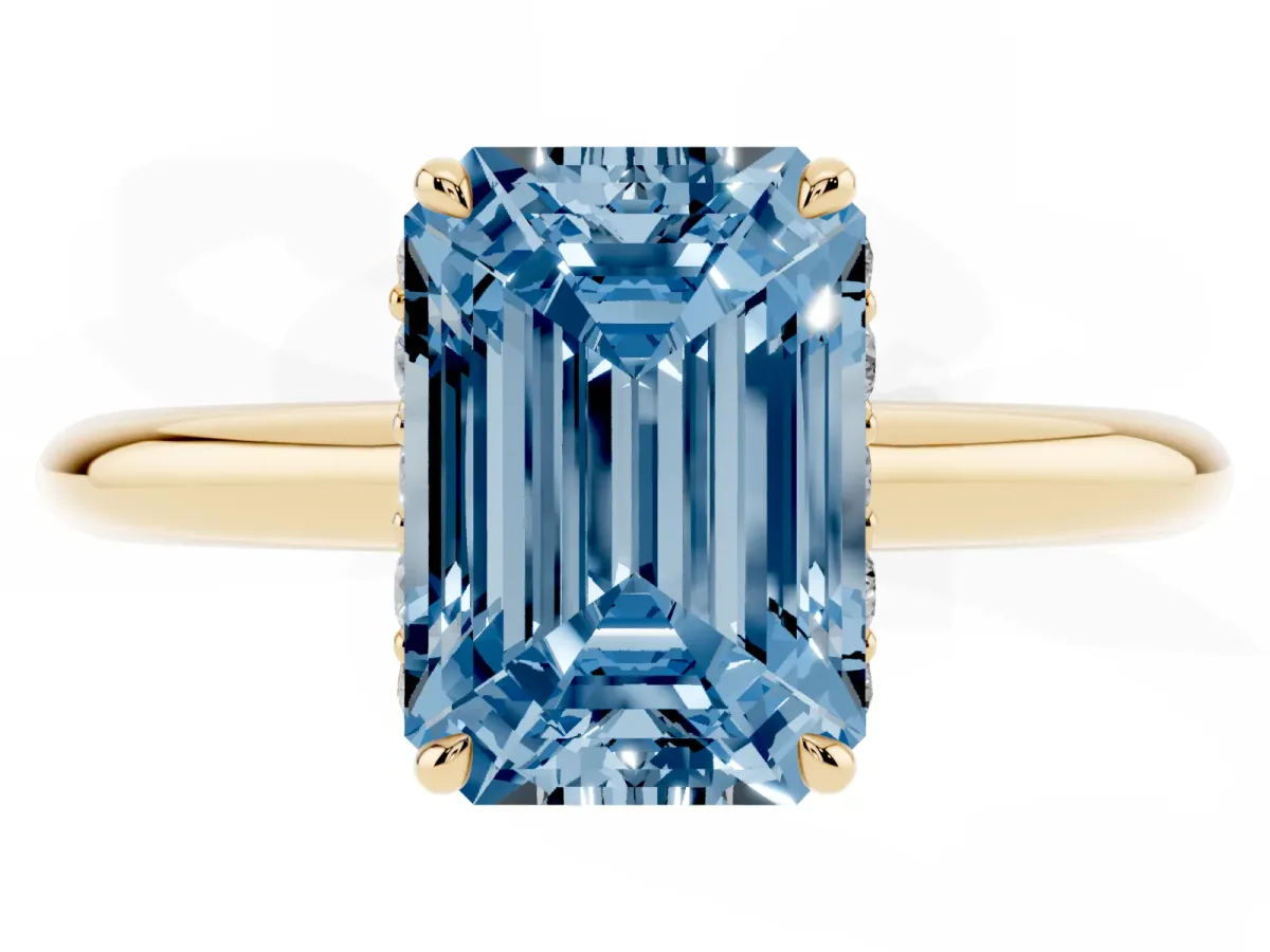 Fancy Blue Emerald Cut Brilliant Solitaire Engagement Ring with Six-Prong Setting and Classic Band Yellow gold