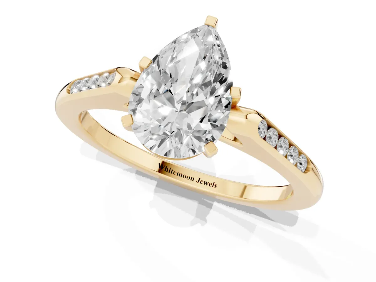 Pear Cut Diamond Solitaire Ring with Channel Set Round Band and Prong Setting Yellow gold