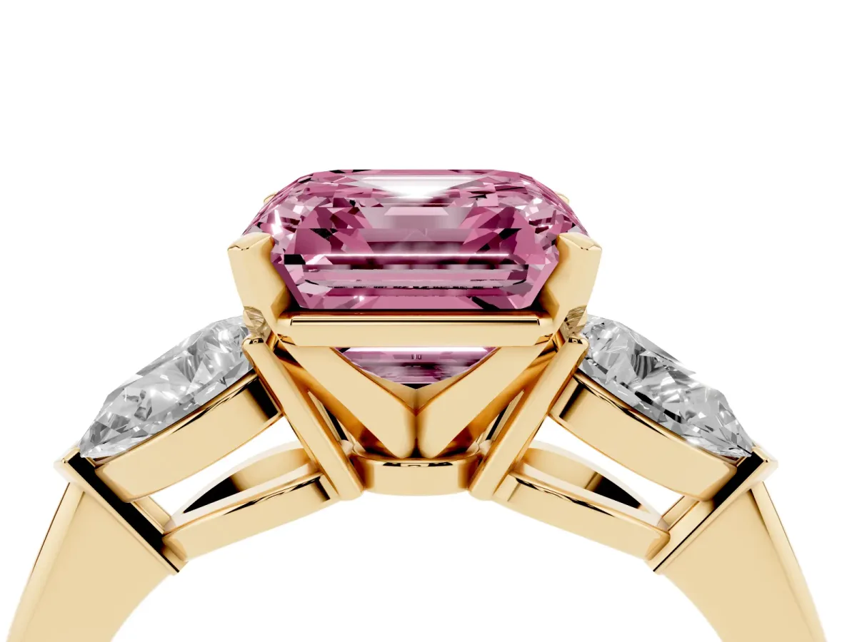 Fancy Pink Three-Stone Asscher Cut Diamond Ring with Pear Side Stones and Four-Prong Setting Yellow gold