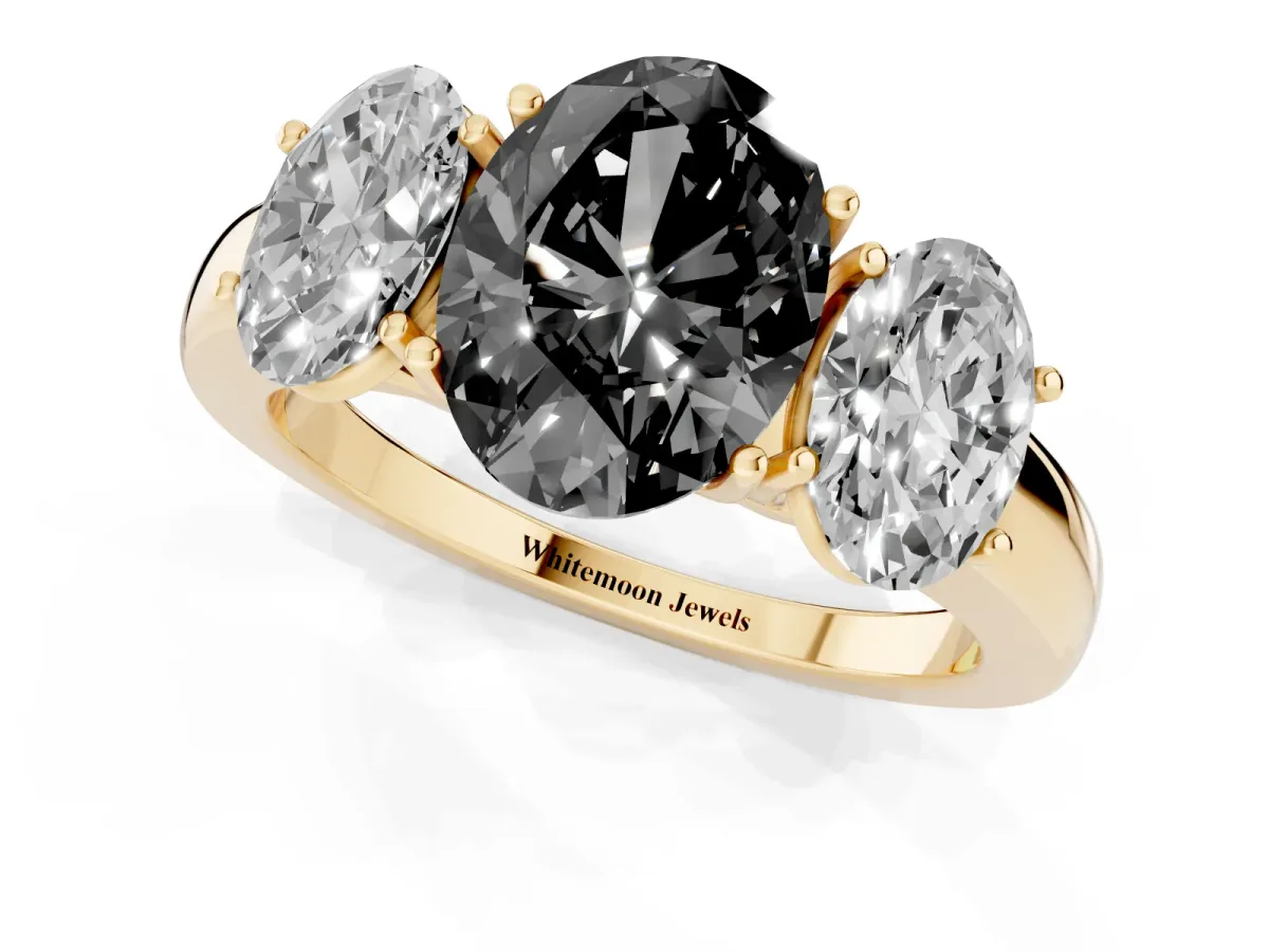 Fancy Black Oval Cut Diamond Three-Stone Ring with Four-Prong Setting and Classic Band Yellow gold