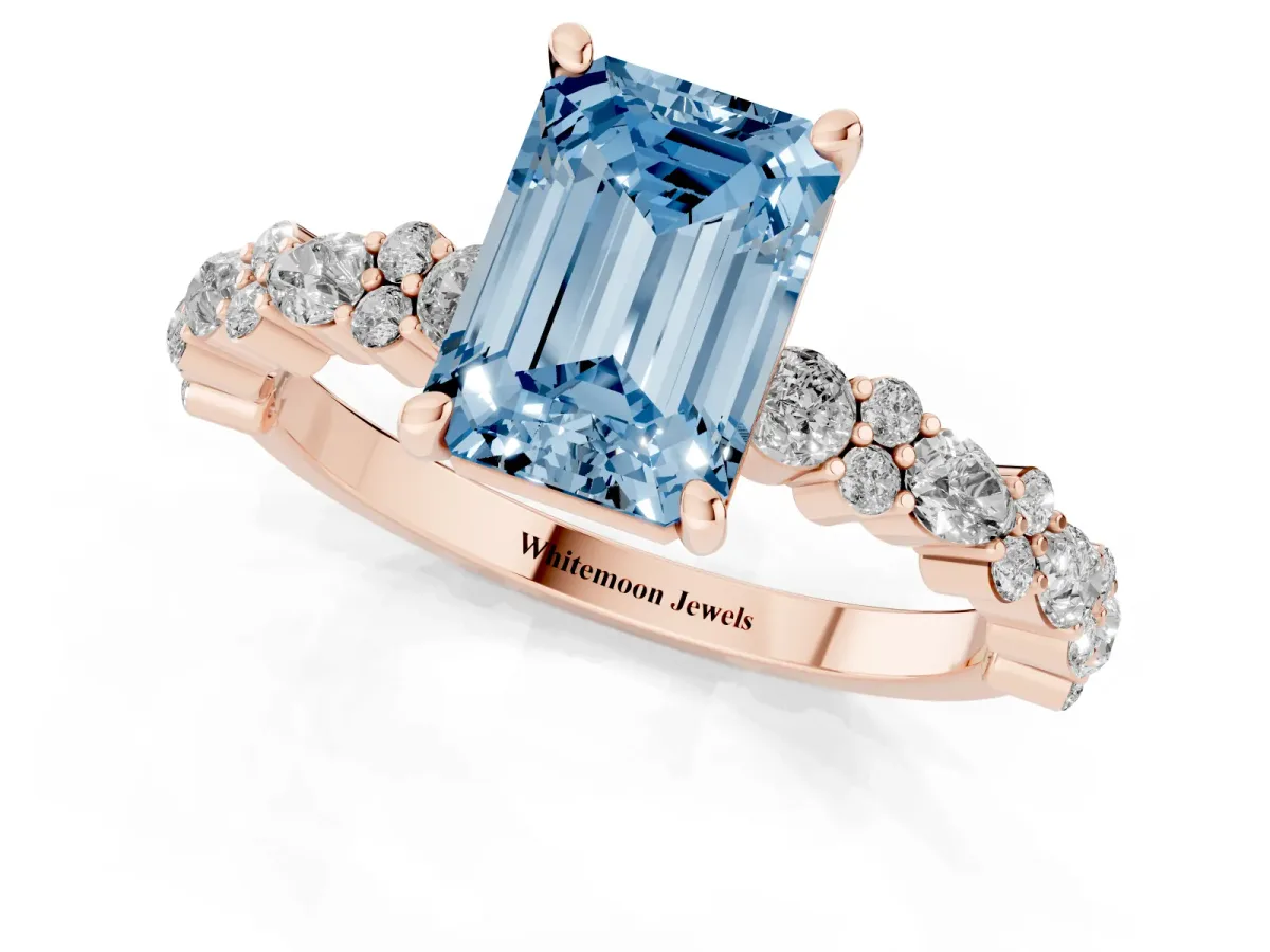 Fancy Blue Emerald Cut Diamond Side Stone Solitaire Ring with Round and Four-Prong Setting Rose gold