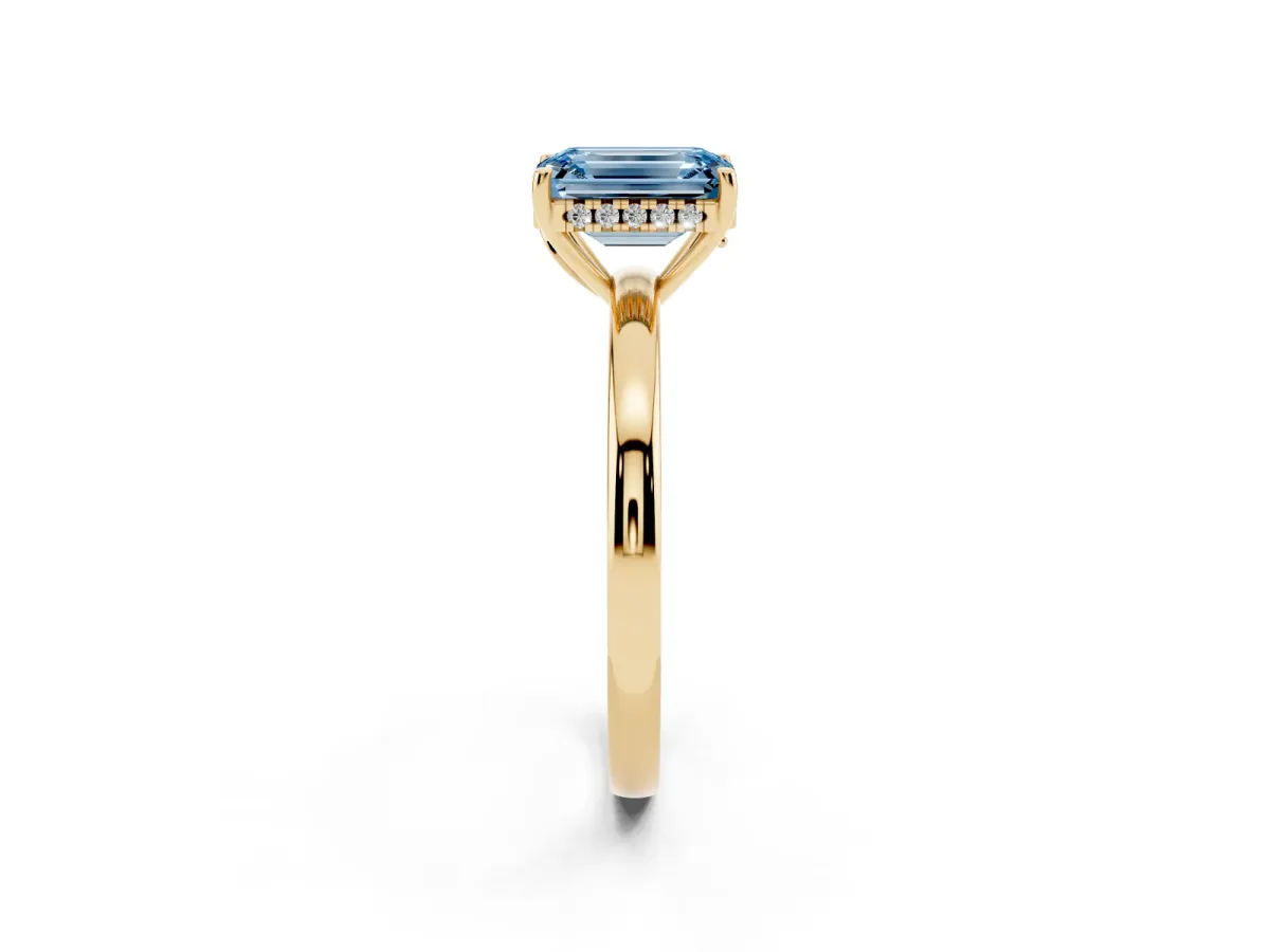 Fancy Blue Emerald Cut Solitaire Diamond Ring with Prong Setting and Plain Band Yellow gold
