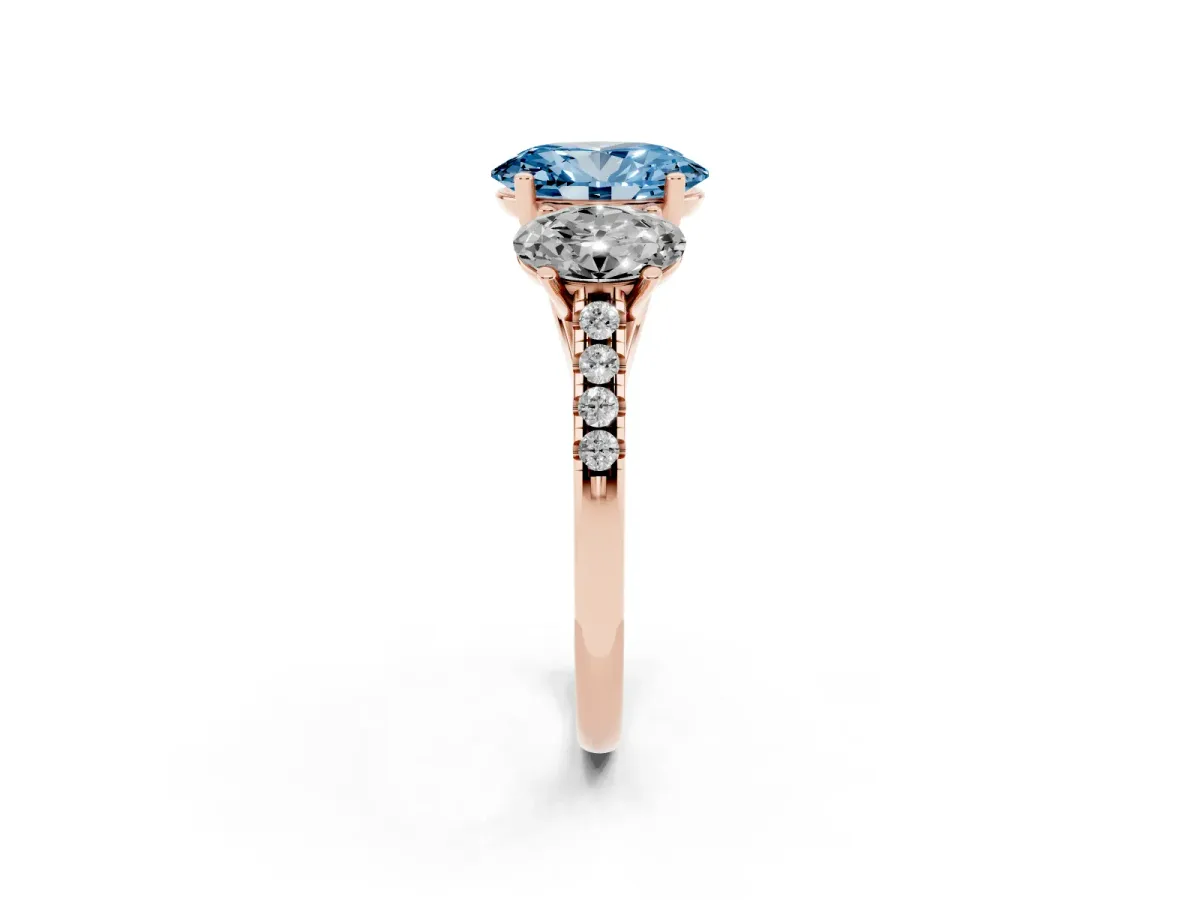 Fancy Blue Three-Stone Oval Cut Diamond Ring with Round Pavé Band and Prong Setting Rose gold