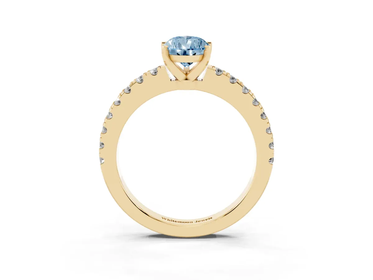 Fancy Blue Pear Cut Solitaire Diamond with Pavé Band and Four-Prong Setting Yellow gold