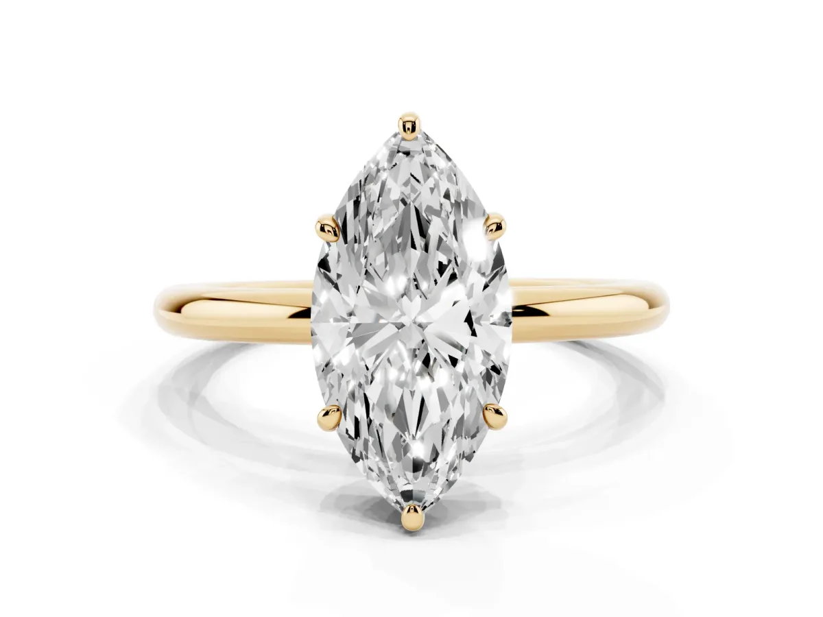 Marquise Cut Solitaire Diamond Ring with Four-Prong Setting on a Plain Band Yellow gold