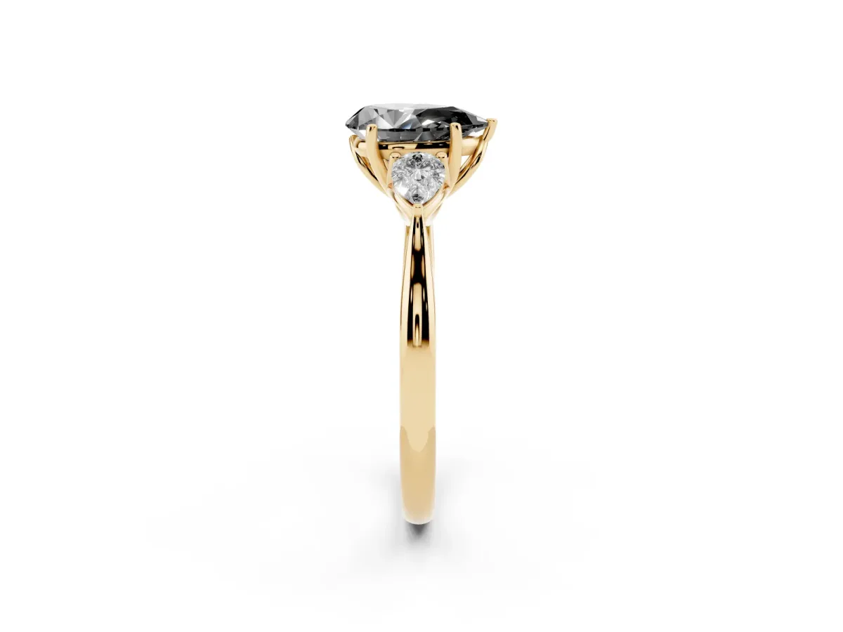 Fancy Black Pear Cut Diamond Three-Stone Ring with Pear Side Stones and Prong Setting Yellow gold
