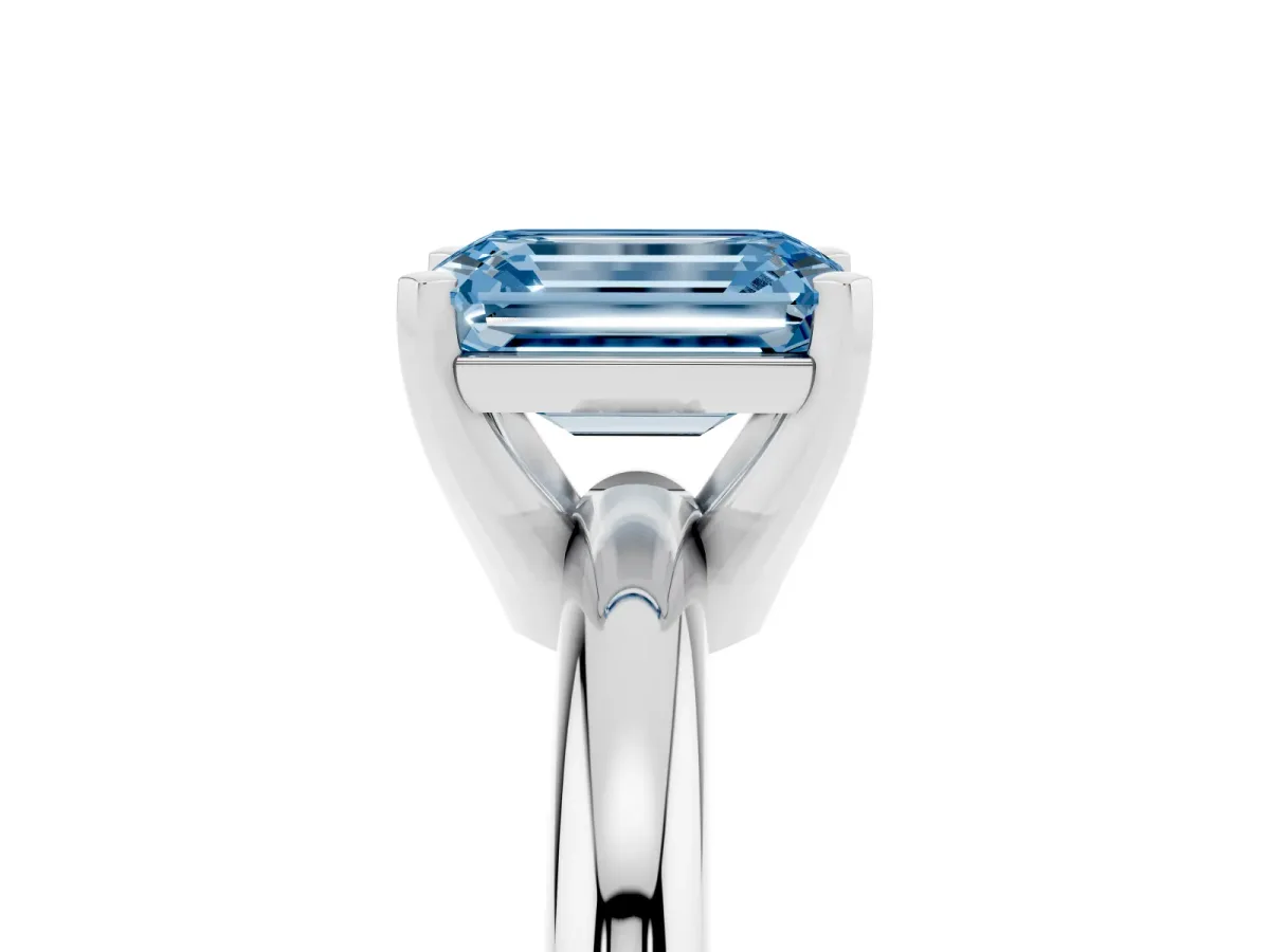 Fancy Blue Emerald Cut Diamond Solitaire Engagement Ring with Round Band and Four-Prong Setting Silver