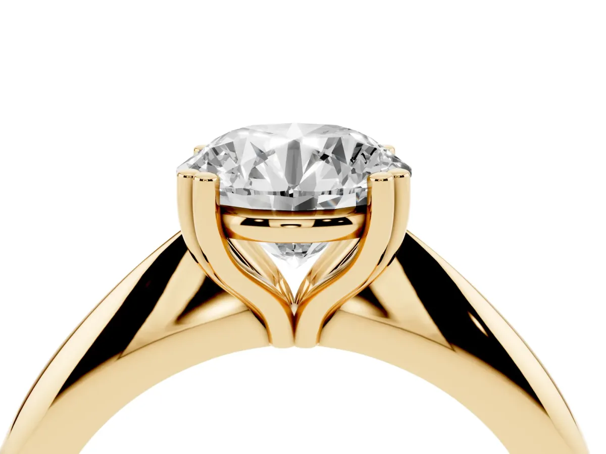 Round Cut Cut Solitaire Engagement Ring with Tapered Band and Four-Prong Setting Yellow gold