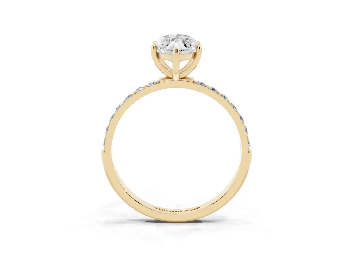 Marquise Cut Diamond Solitaire Ring with Round Pavé Shoulders and Prong Setting Yellow gold