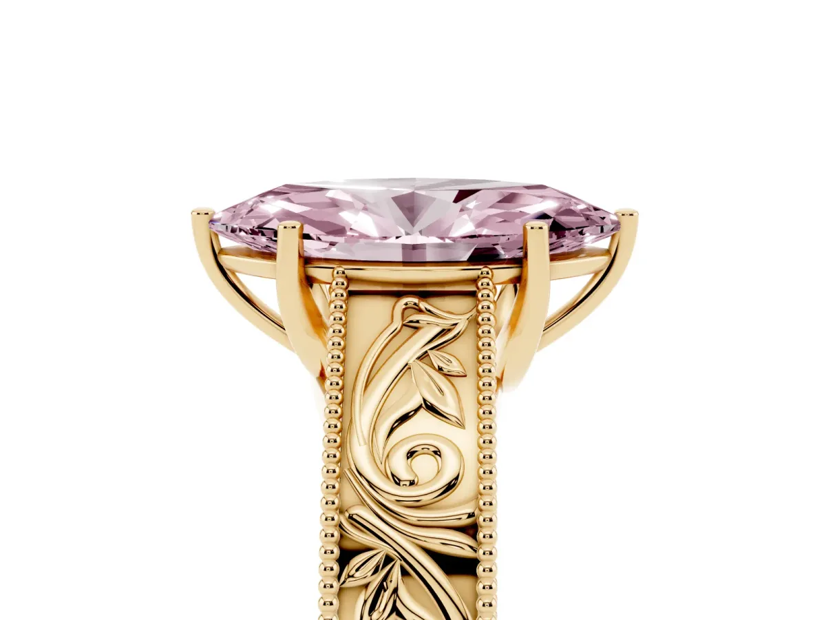 Fancy Pink Marquise Cut Diamond Solitaire Ring with Engraved Band and Four-Prong Setting Yellow gold
