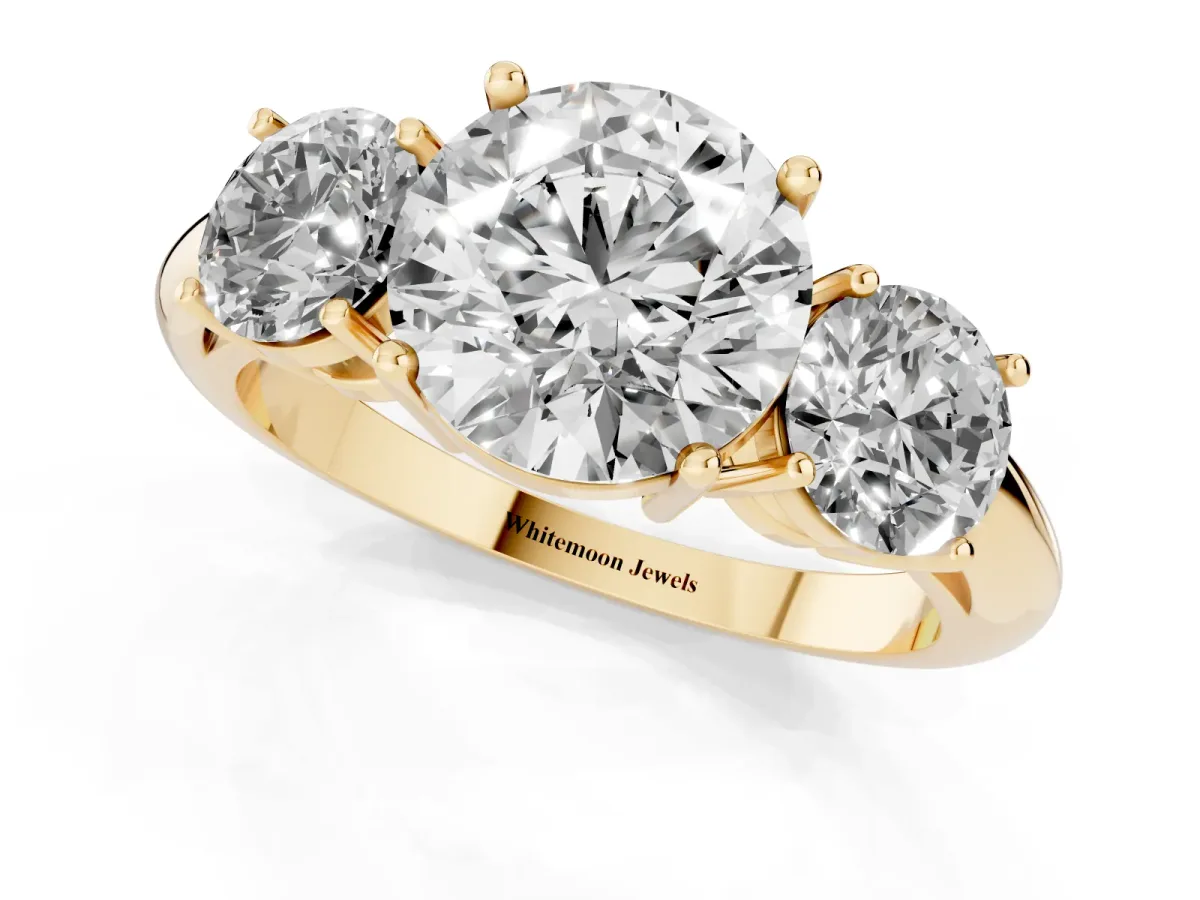 Three-Stone Round Cut Cut Diamond Engagement Ring with Prong Setting on a White Gold Band Yellow gold