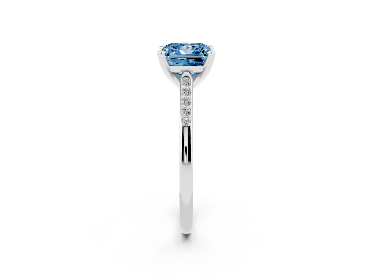 Fancy Blue Princess Cut Diamond Solitaire Ring with Channel Set Round Band and Prong Setting Silver