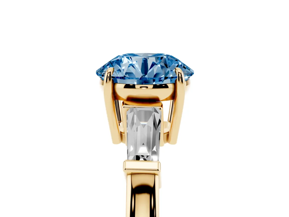 Fancy Blue Round Cut Diamond Three-Stone Ring with Tapered Baguette Side Stones and Prong Setting Yellow gold