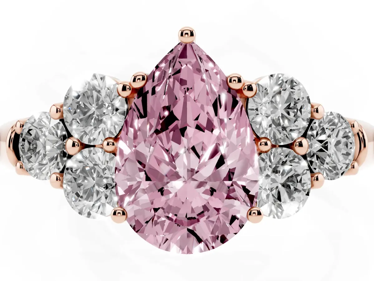 Fancy Pink Pear Cut Cut Diamond Cluster Ring with Round Accent Stones and Prong Setting on a Classic Band Rose gold
