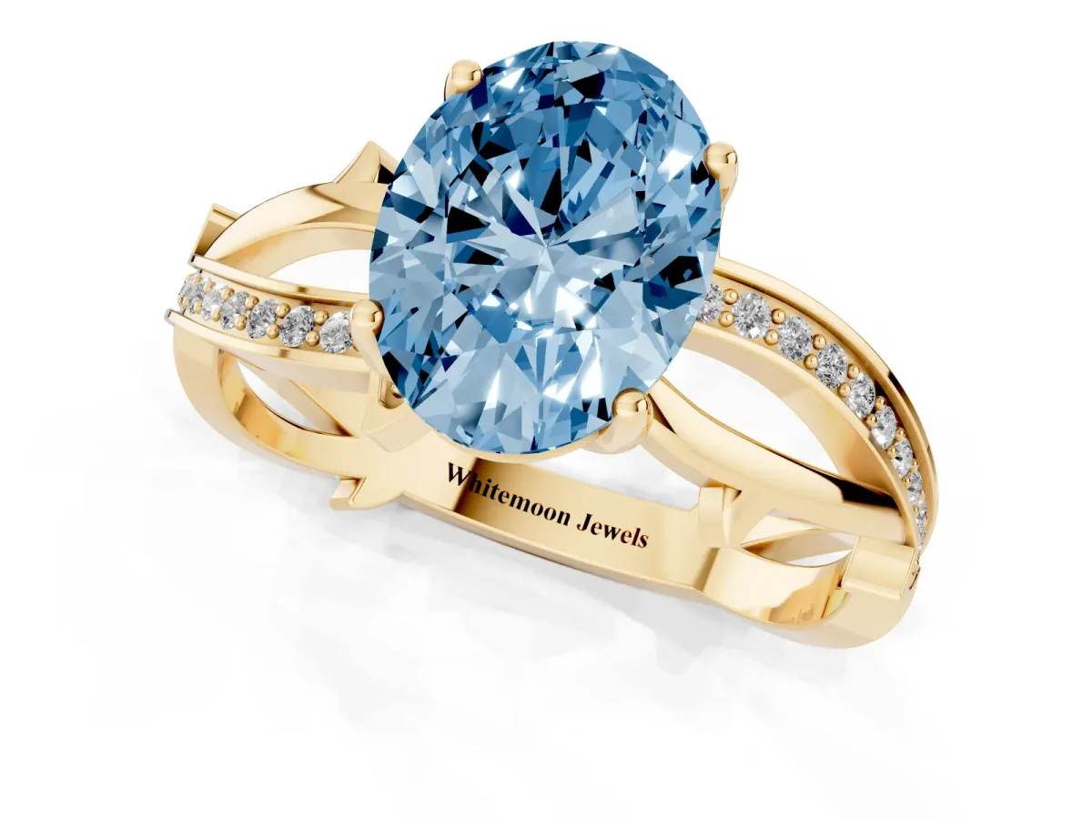 Fancy Blue Oval Cut Solitaire Twist Band with Pavé Accents and Four-Prong Setting Yellow gold