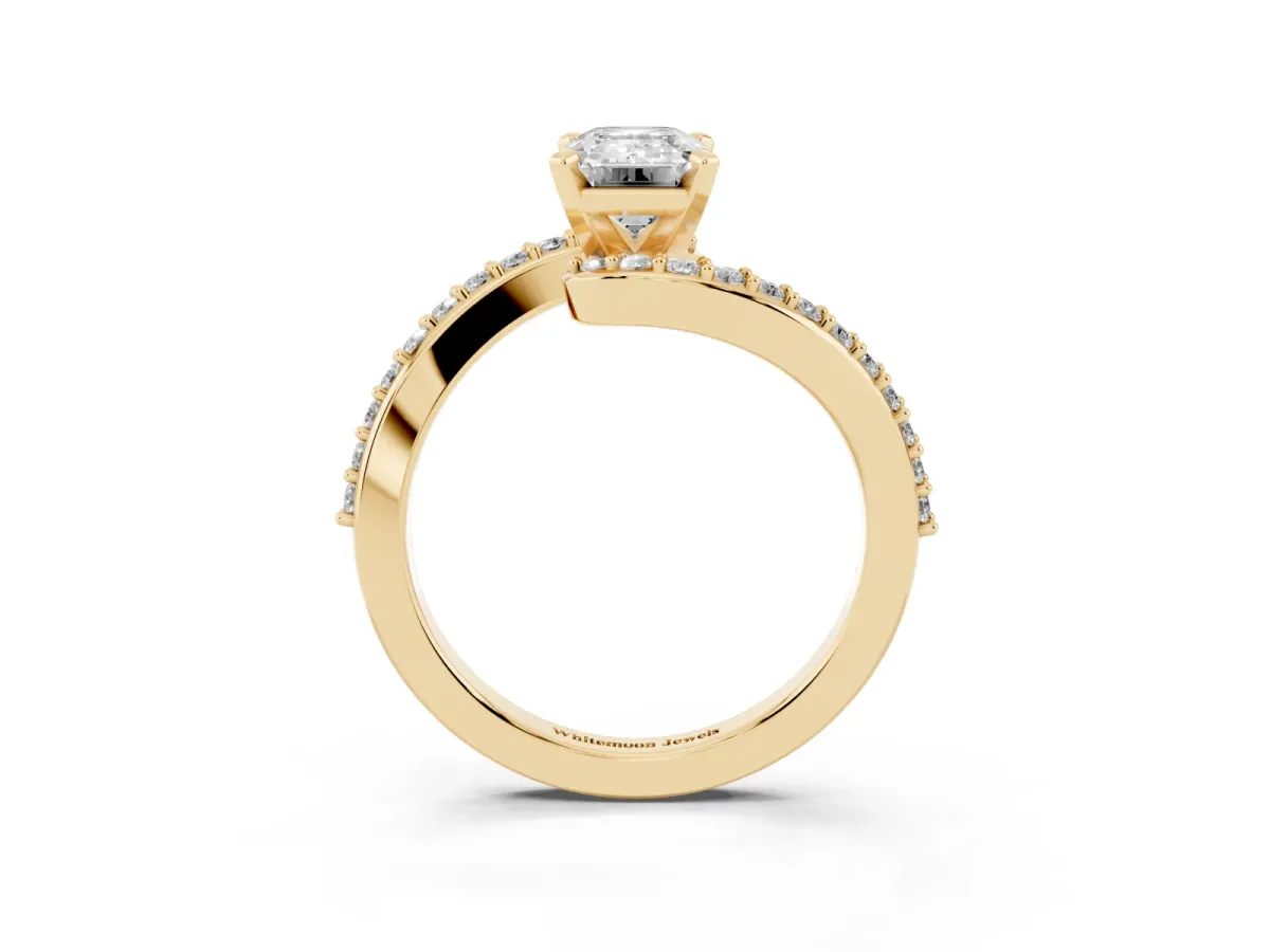 Emerald Cut Solitaire Twist Band with Pave Set Diamonds and Four-Prong Setting Yellow gold