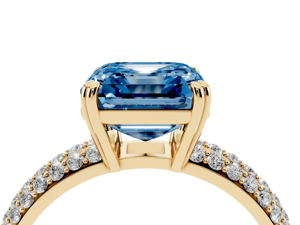Fancy Blue Asscher Cut Diamond Solitaire Ring with Multi-Row Round Pavé Band and Prong Setting Yellow gold