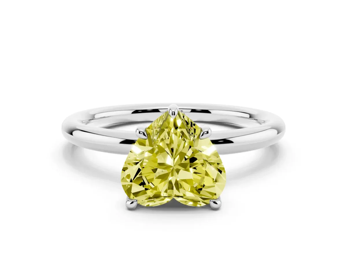Fancy Yellow Heart Cut Diamond Solitaire Ring with Thin Band and Four-Prong Setting Silver