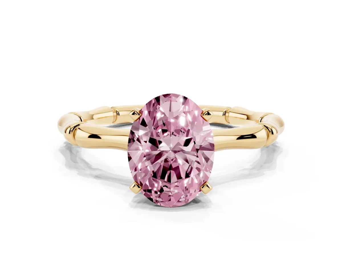 Fancy Pink Oval Cut Solitaire Diamond Ring with Bamboo Band and Four-Prong Setting Yellow gold