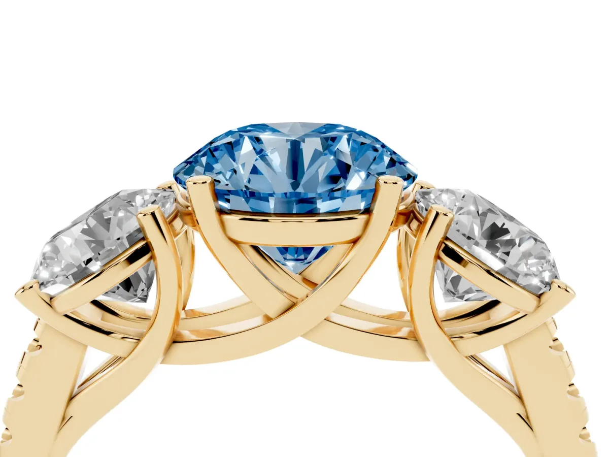 Fancy Blue Three-Stone Round Cut Diamond Ring with Round Pavé Band and Prong Setting Yellow gold