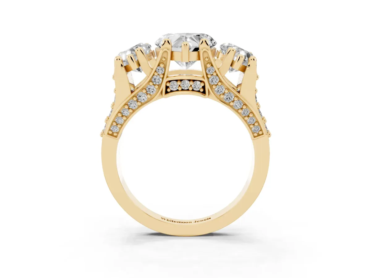 Heart Cut Diamond Three-Stone Ring with Channel Set Band and Four-Prong Setting Yellow gold