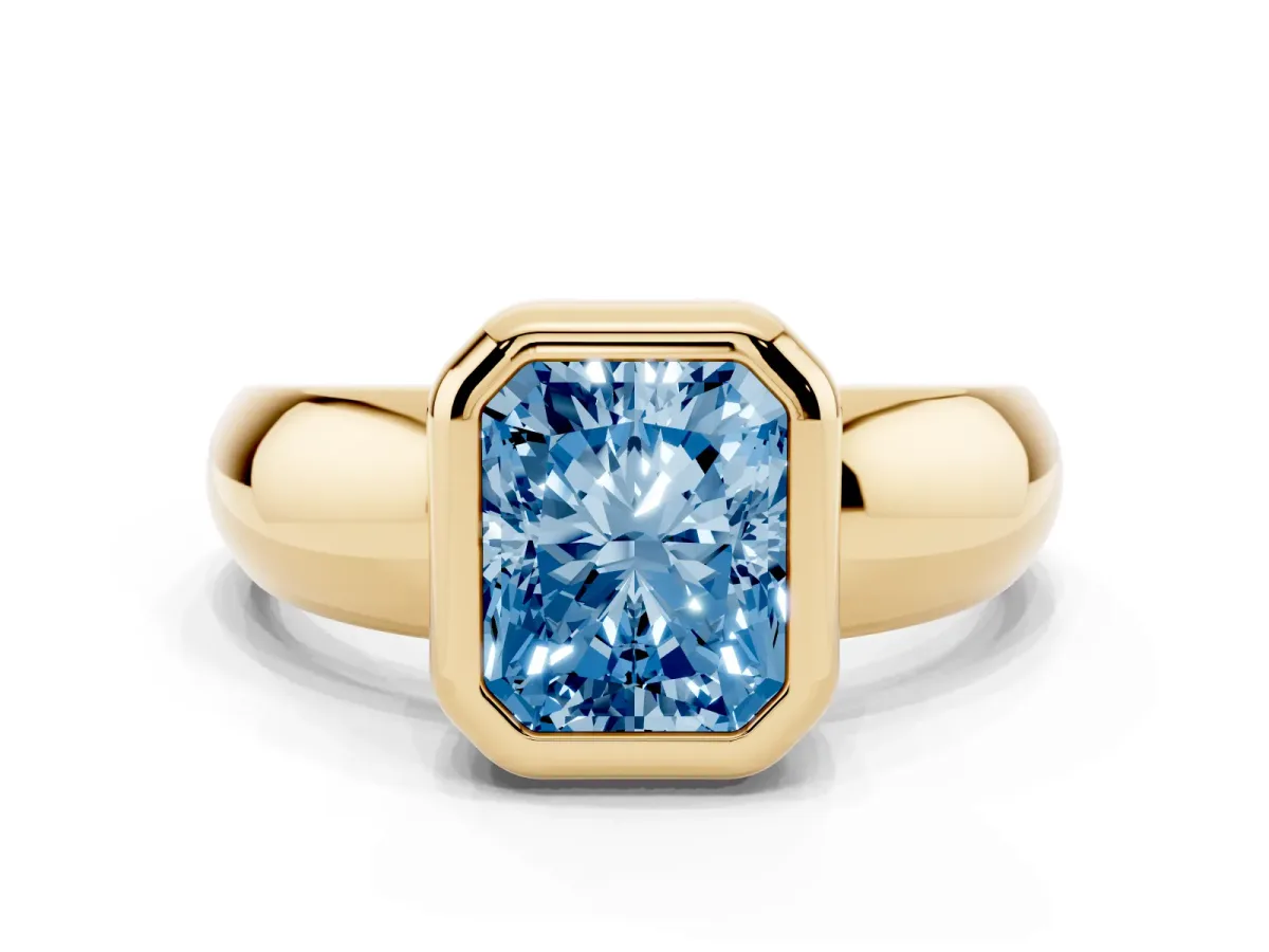 Fancy Blue Bezel Set Radiant Cut Solitaire Ring with Wide Band Yellow gold