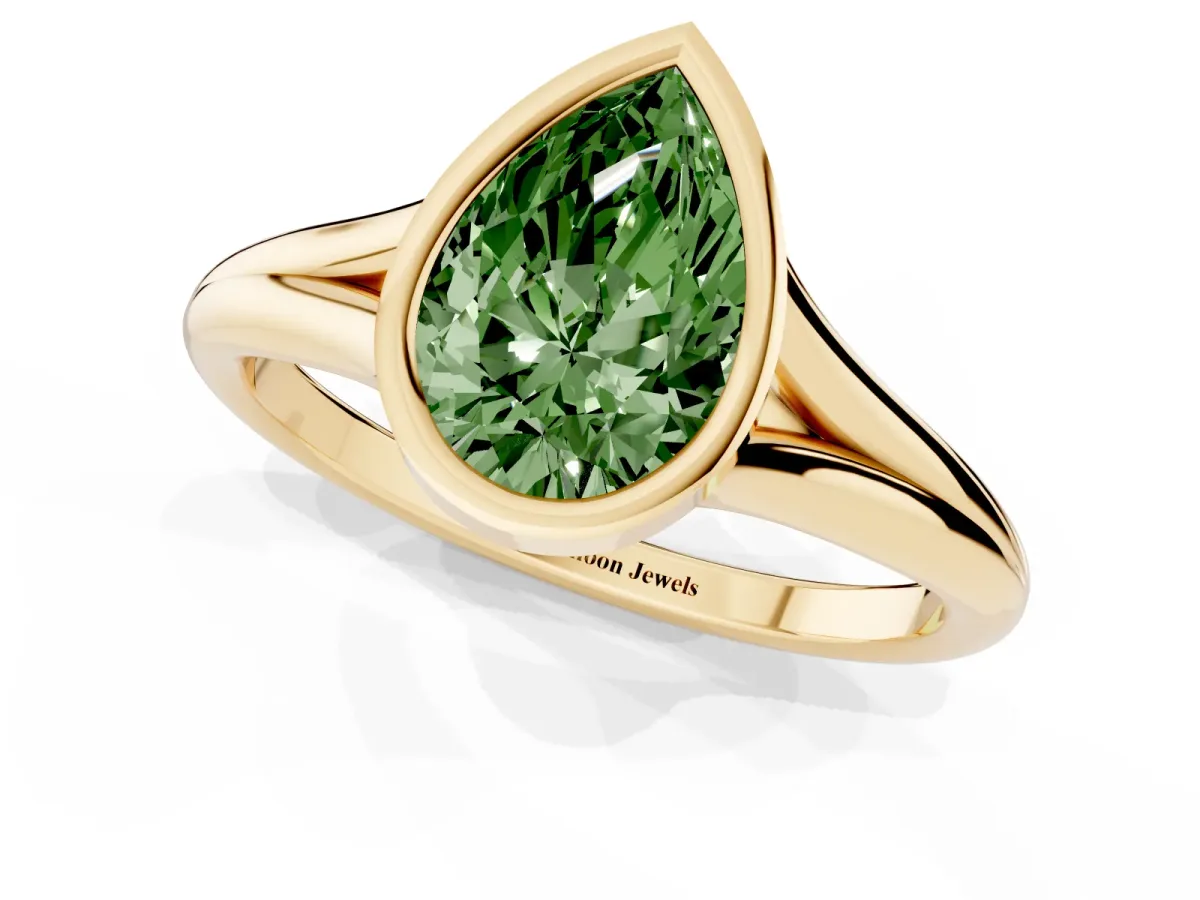 Fancy Green Bezel Set Pear Cut Cut Solitaire Ring with Tapered Band Yellow gold