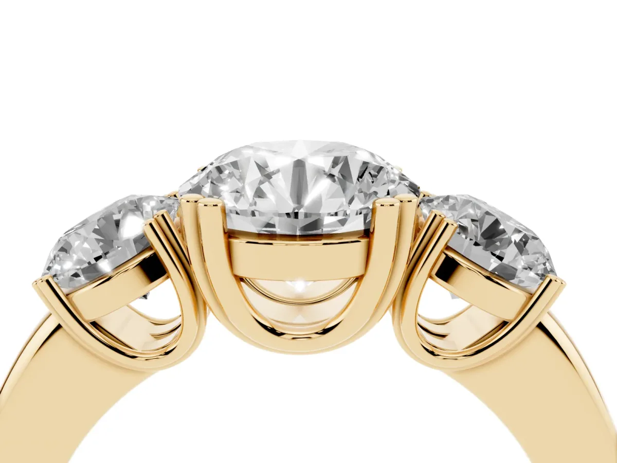 Three-Stone Round Cut Cut Diamond Ring with Channel Set Band and Four-Prong Setting Yellow gold