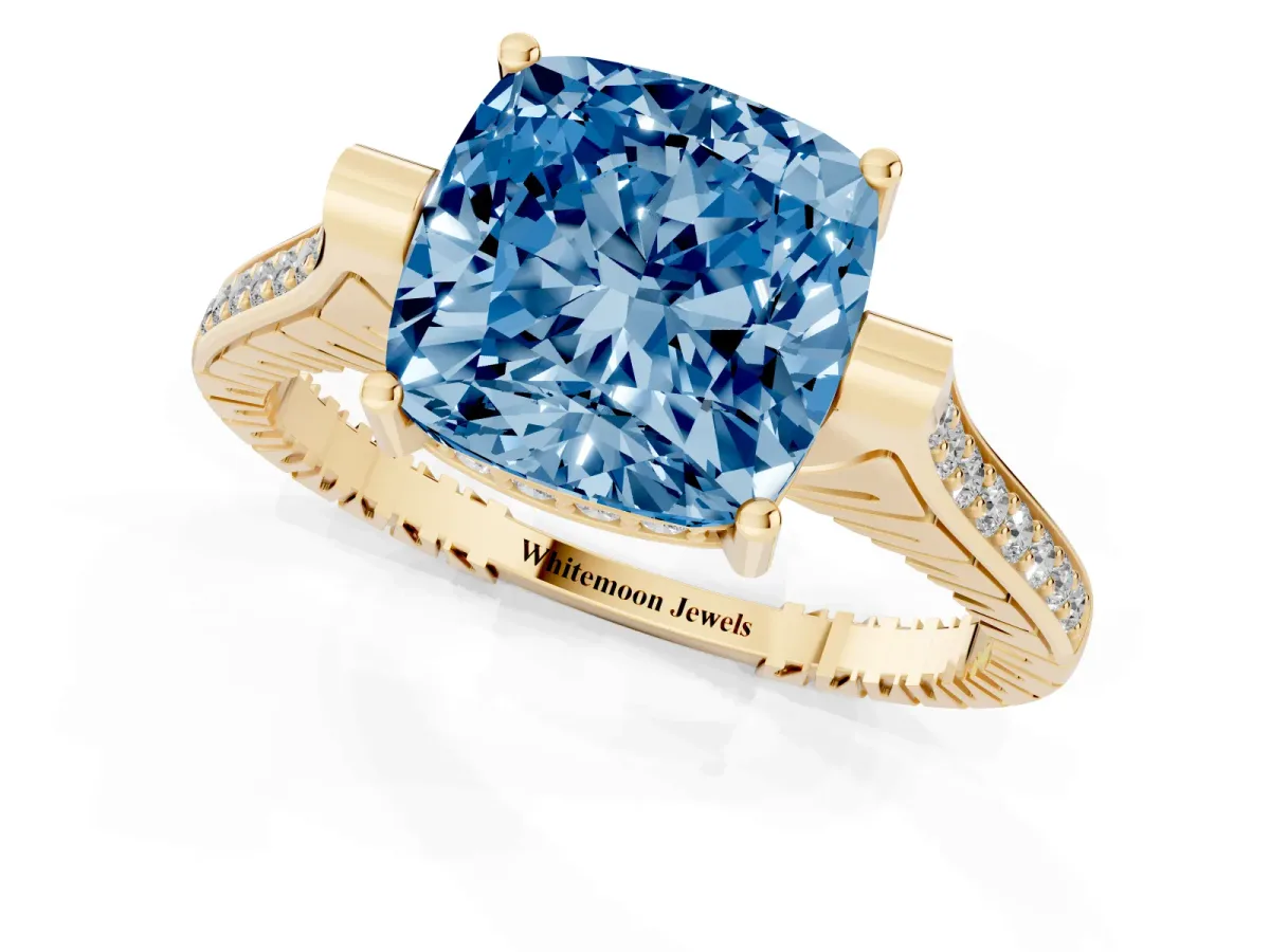 Fancy Blue Cushion Cut Solitaire Diamond Ring with Channel Set Band and Bezel Prong Setting Yellow gold