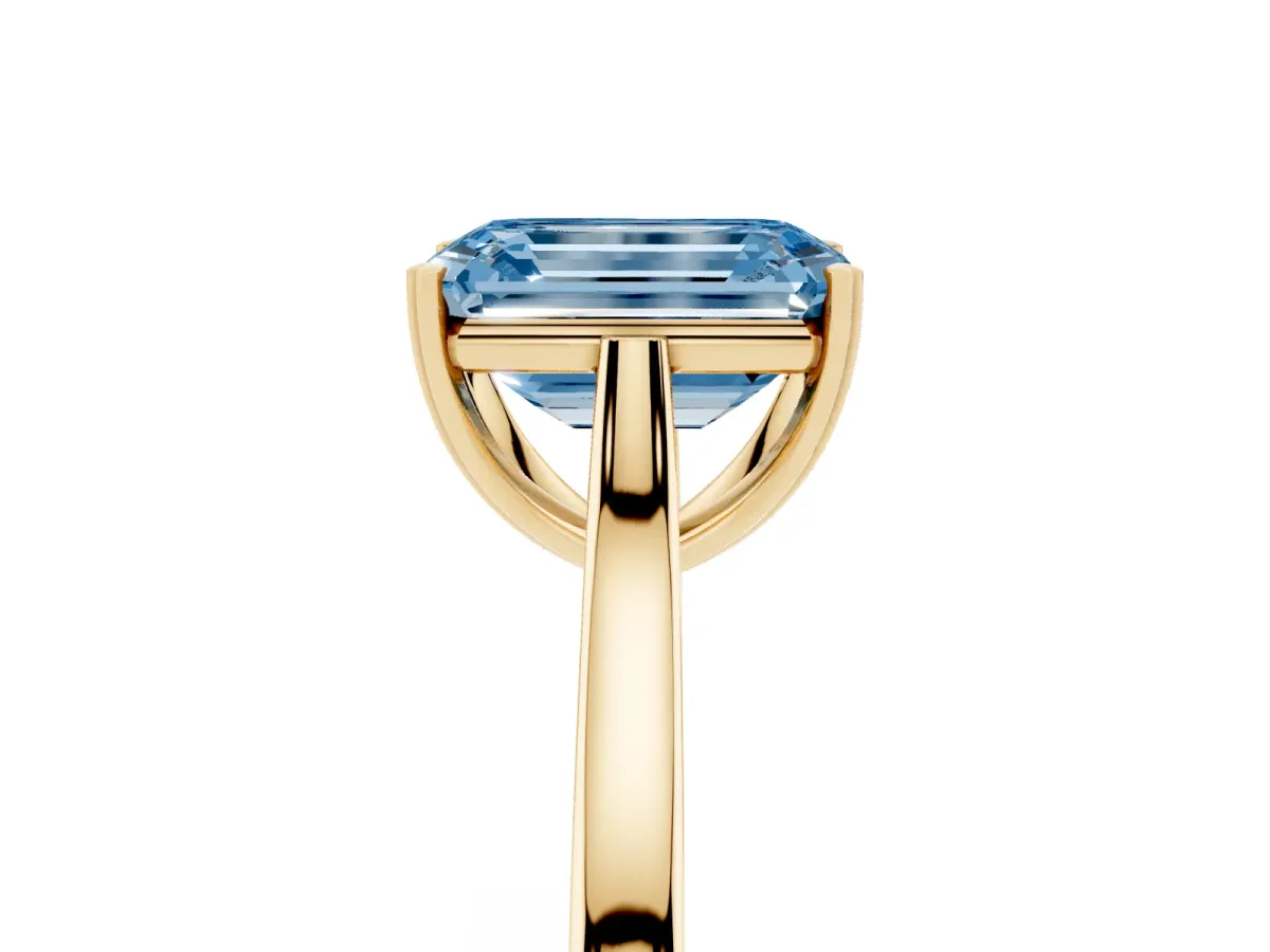 Fancy Blue Emerald Cut Solitaire Heart Prong Engagement Ring with Tapered Band Yellow gold