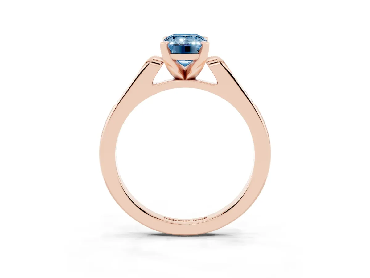 Fancy Blue Emerald Cut Diamond Solitaire Ring with Channel Set Round Band and Prong Setting Rose gold